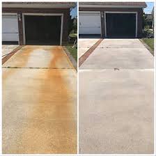 Driveway by garage before and after rust removal